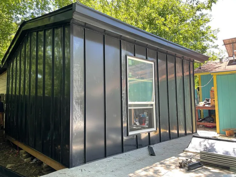 Black standing seam metal wall panels for Roof Inspection in Basehor